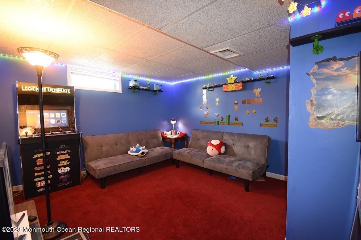 40 Alan Terrace Howell, NJ 07731 - Photo 36 of 48 a living room with furniture and flat screen tv