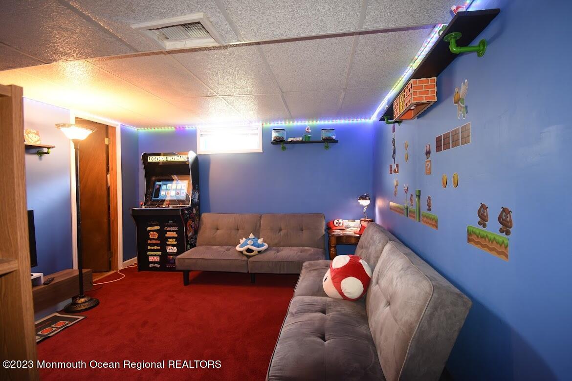 40 Alan Terrace Howell, NJ 07731 - Photo 38 of 48 a living room with furniture and a flat screen tv