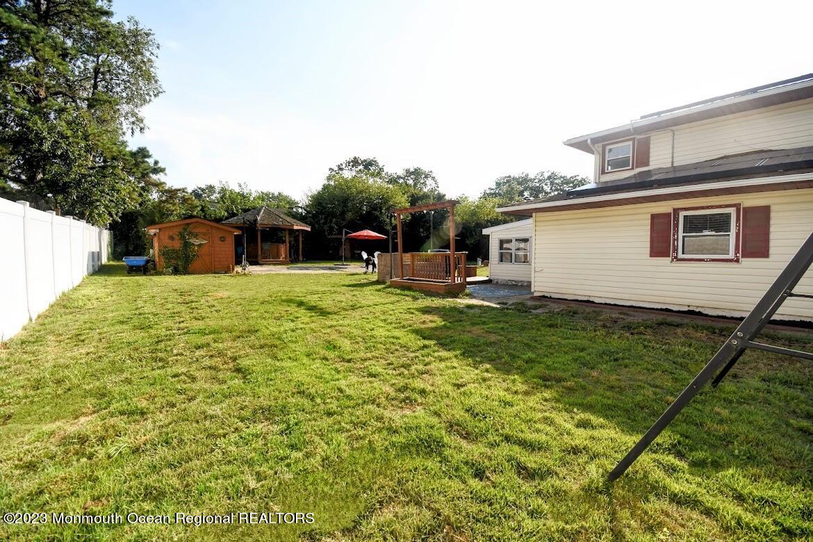 40 Alan Terrace Howell, NJ 07731 - Photo 47 of 48 a view of a backyard with plants and a patio