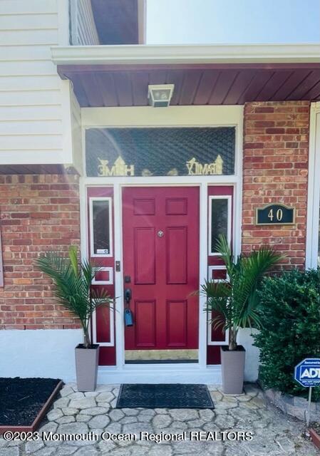 40 Alan Terrace Howell, NJ 07731 - Photo 5 of 48 a front view of a house with potted plants