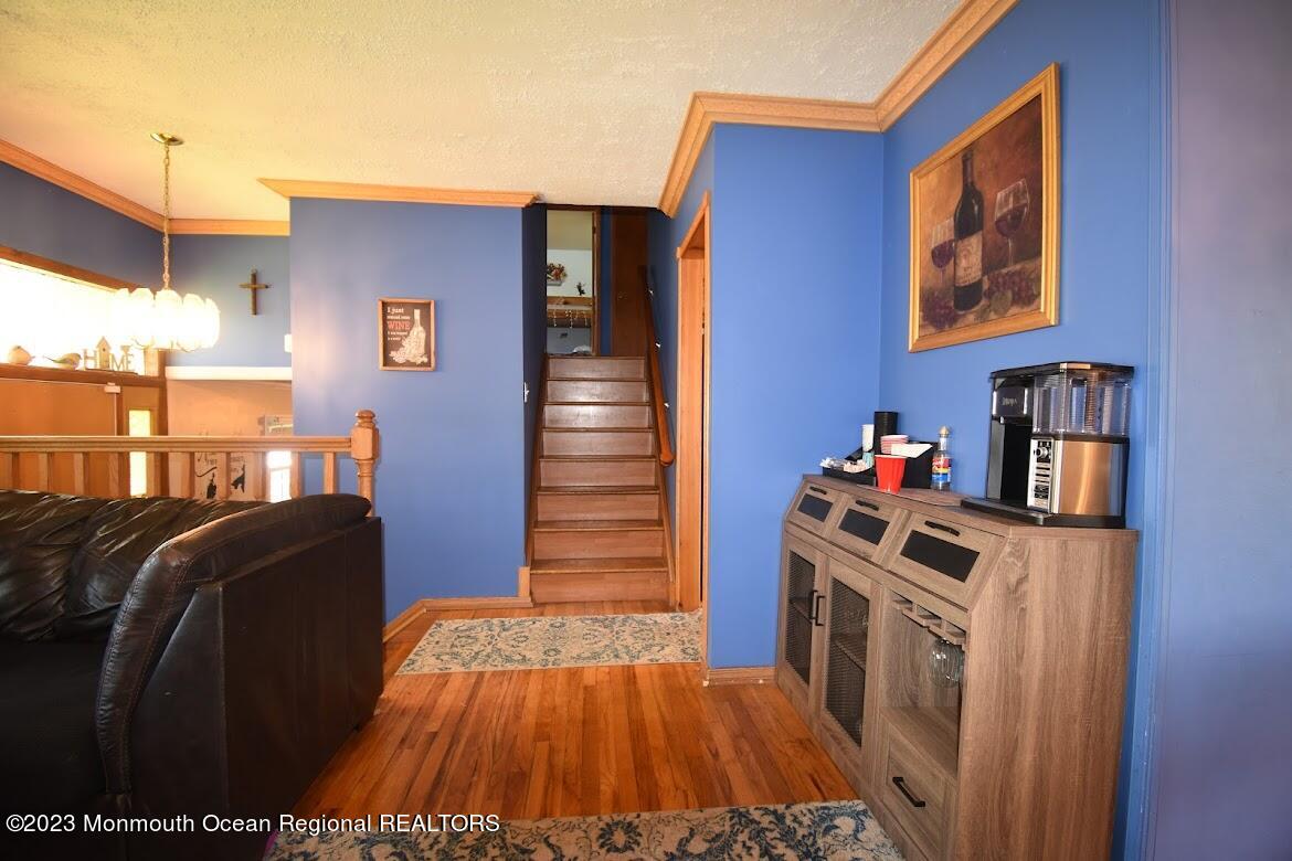 40 Alan Terrace Howell, NJ 07731 - Photo 7 of 48 a view of a bedroom with a bed and wooden floor