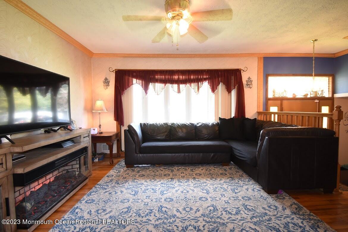40 Alan Terrace Howell, NJ 07731 - Photo 10 of 48 a living room with furniture and a flat screen tv
