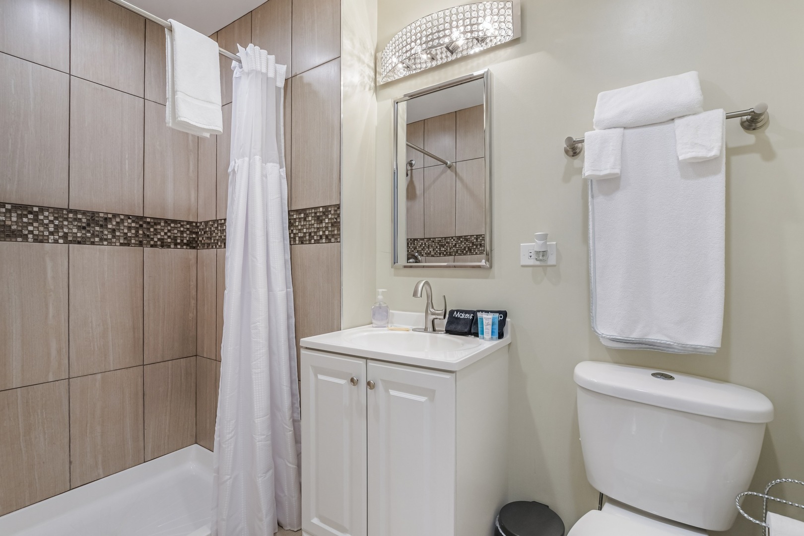 4244 South Prairie Avenue Chicago, IL 60653 - Photo 5 of 5 a bathroom with a sink a toilet and shower