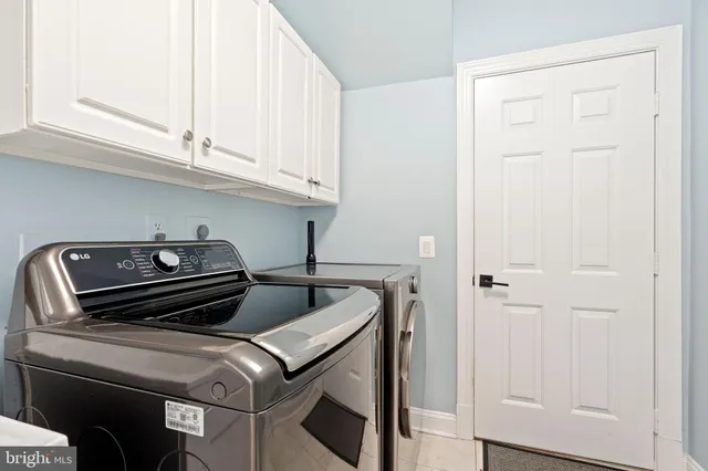a view of empty room with wooden floor and windows
