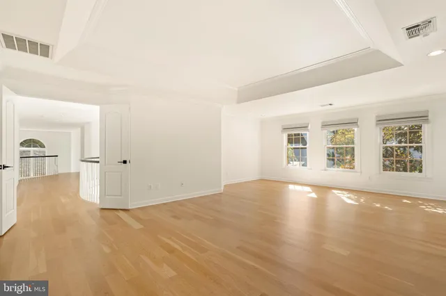 a view of a chairs and tables in the back yard of the house