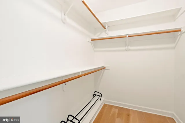 a front view of a house with a garden and plants