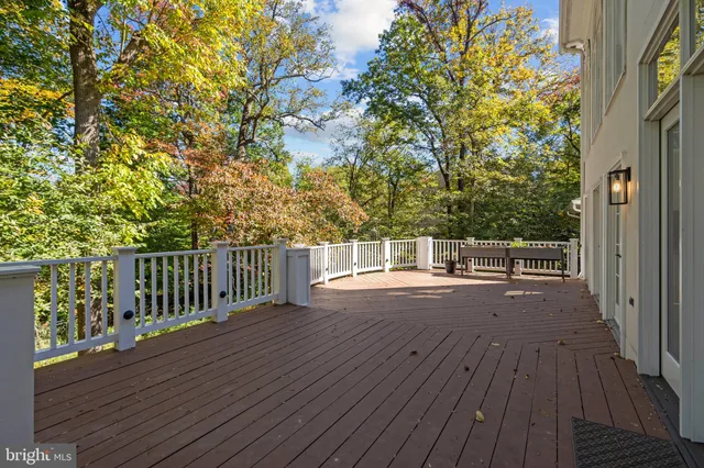 a view of a kitchen with furniture and wooden floor