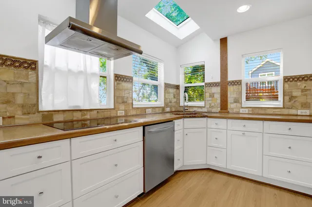 a view of an empty room with glass door and balcony