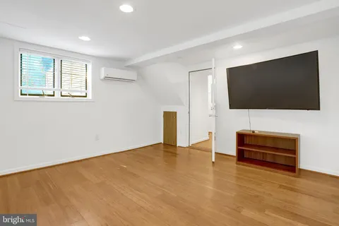a kitchen with a sink and large window