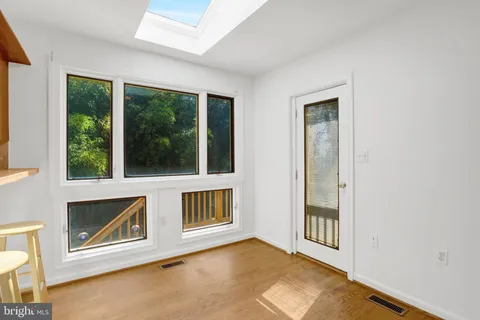 a kitchen with kitchen island cabinets and refrigerator