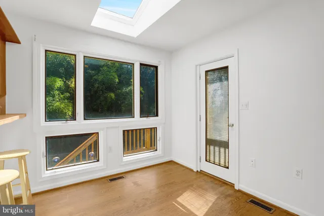 a kitchen with kitchen island cabinets and refrigerator