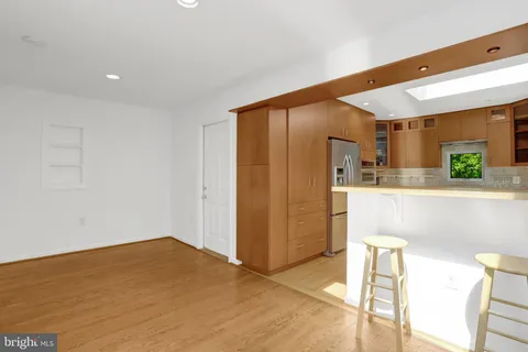 a bathroom with a sink a mirror and a shower