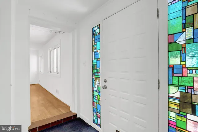 a view of an entryway with wooden floor