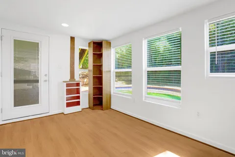 an empty room with a empty space and window