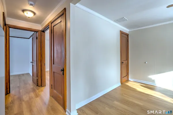 a view of hallway with a large mirror