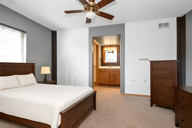 a bedroom with a bed and a closet