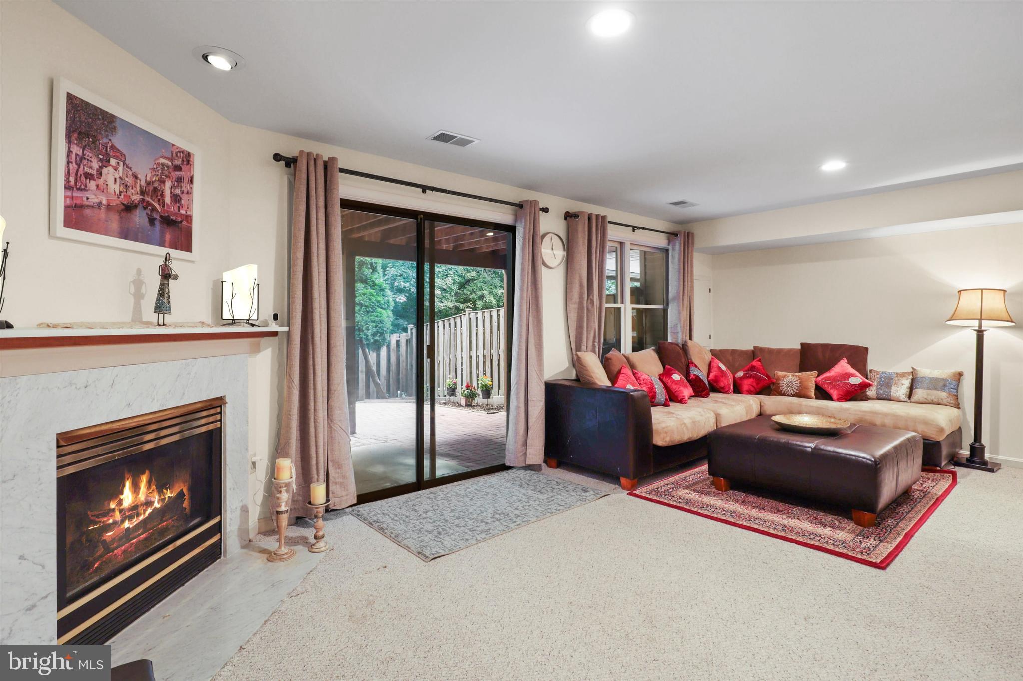 9097 Golden Sunset Lane Springfield, VA 22153 - Photo 24 of 40 Finished basement with fireplace