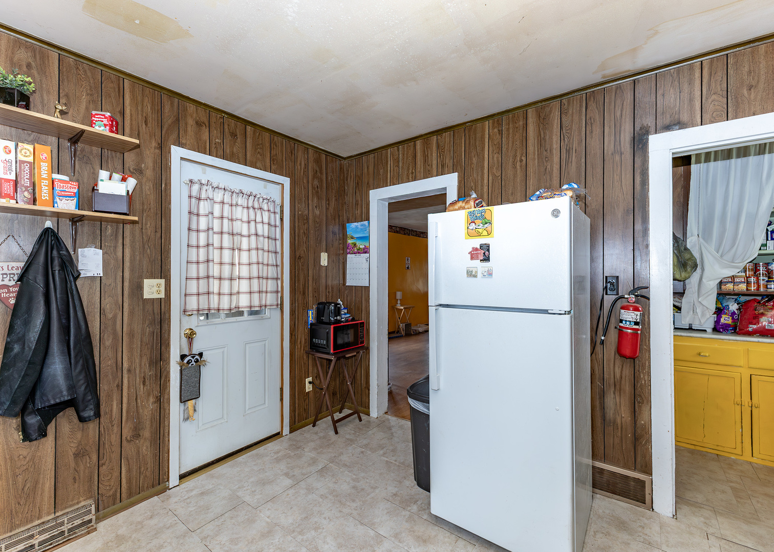 918 16th Avenue Fulton, IL 61252 - Photo 6 of 20 a white refrigerator freezer and a stove sitting inside of a kitchen