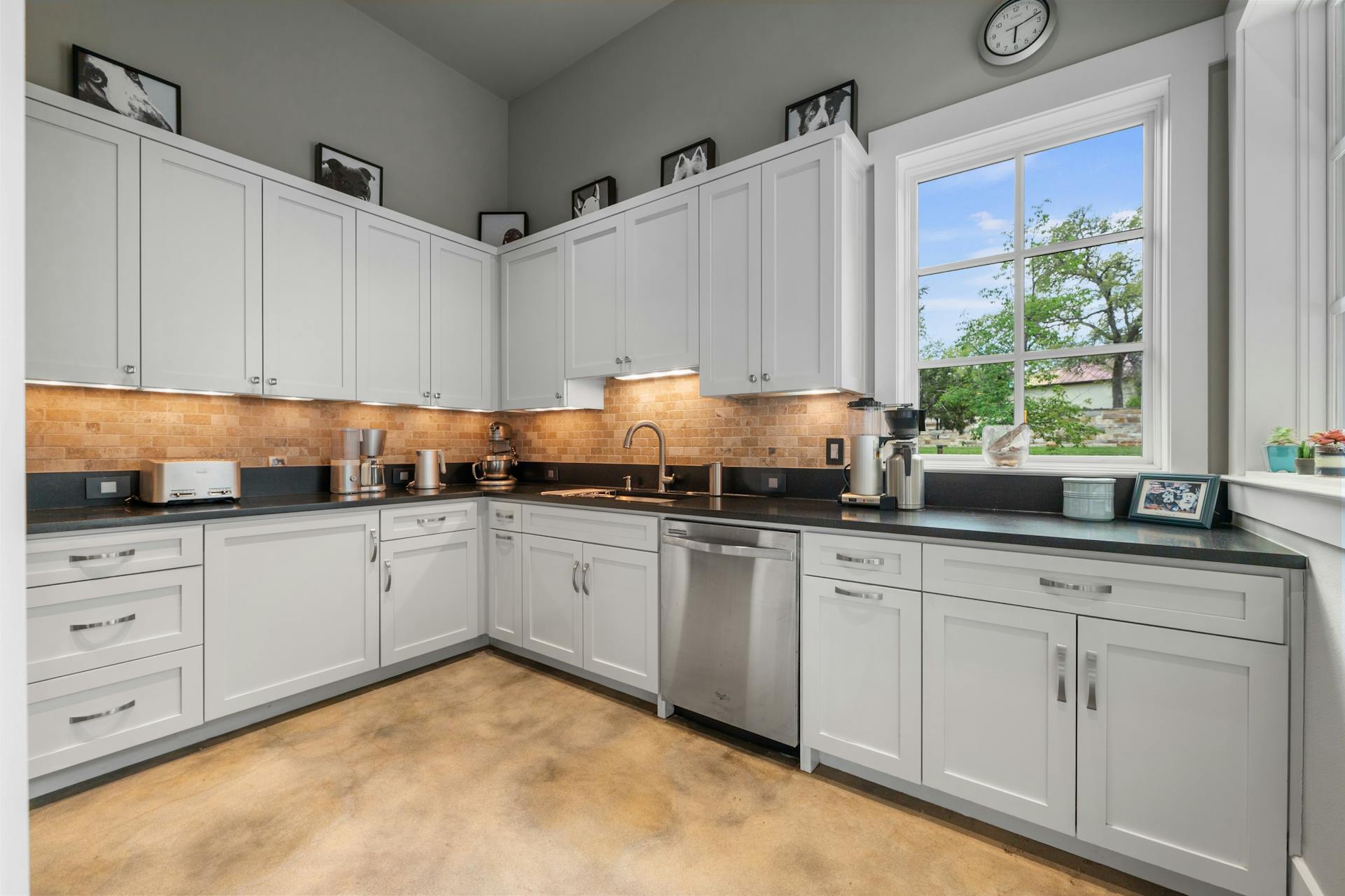 1330 Ranchers Club Lane Driftwood, TX 78619 - Photo 14 of 40 a kitchen with granite countertop white cabinets and white appliances
