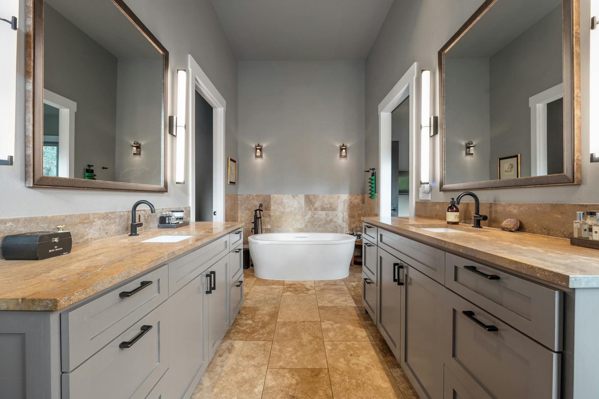 1330 Ranchers Club Lane Driftwood, TX 78619 - Photo 19 of 40 a spacious bathroom with a double vanity sink double mirror and bathtub