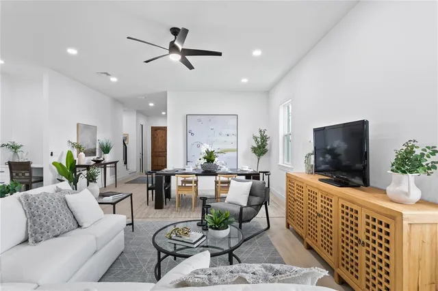 a kitchen with a refrigerator and a white wall
