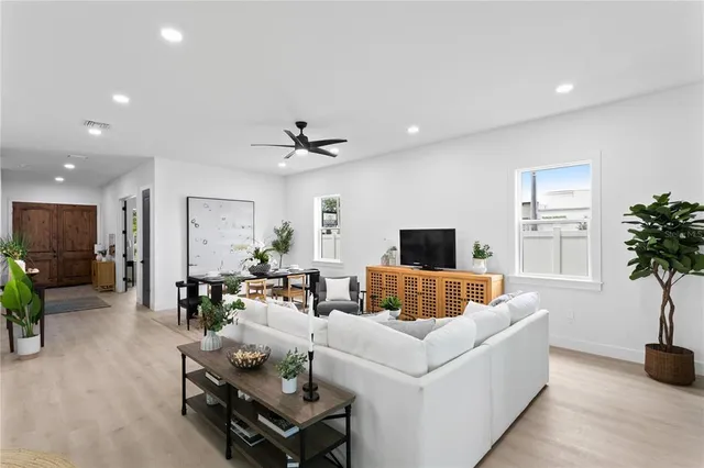 a kitchen with white cabinets and stainless steel appliances