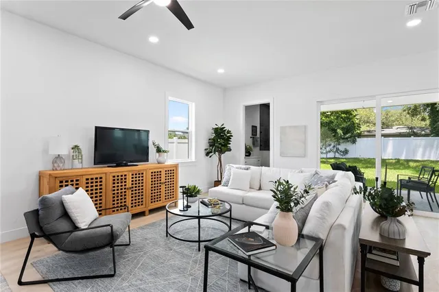 a kitchen with a sink stainless steel appliances and cabinets