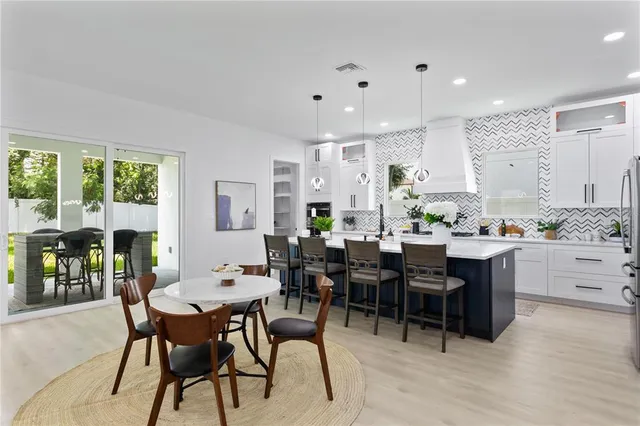 a bedroom with a bed and a potted plant
