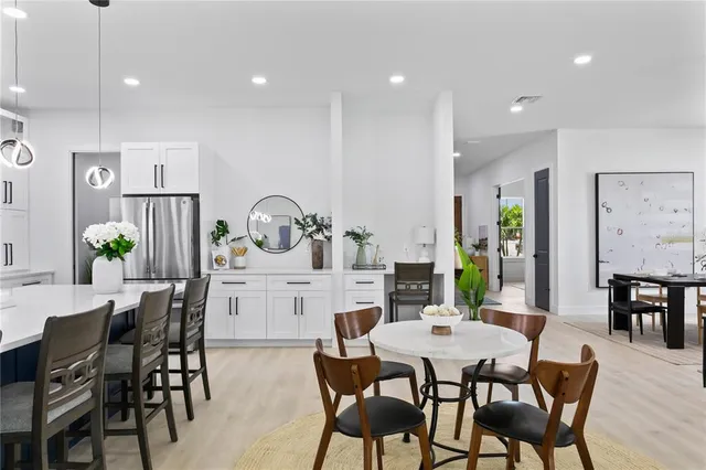 a spacious bedroom with a large bed and a couch