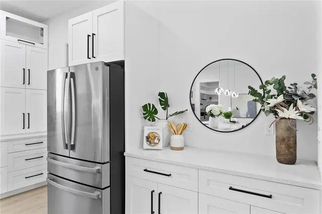 a bedroom with a large bed couch and a window