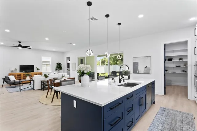 a bathroom with a sink a shower a mirror and a bathtub