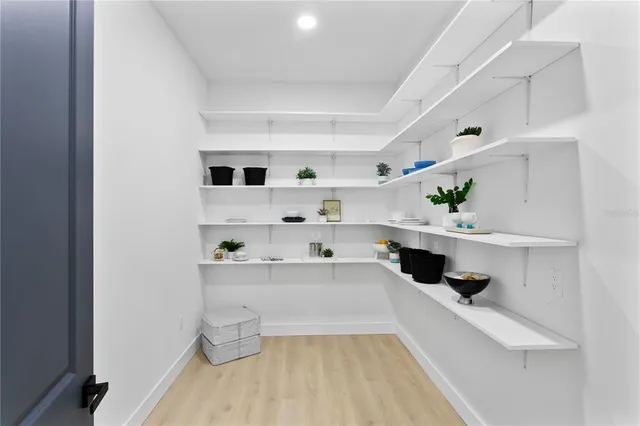a bathroom with a sink vanity and mirror