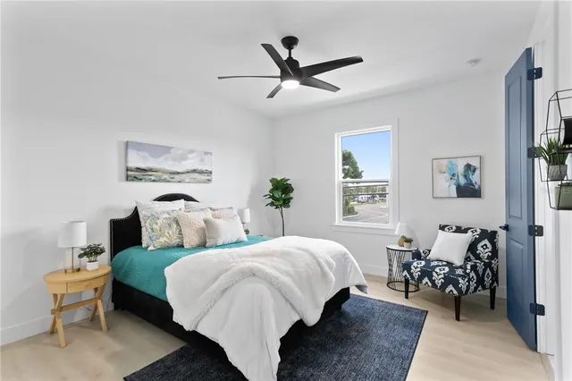 an aerial view of residential houses with outdoor space and ocean view