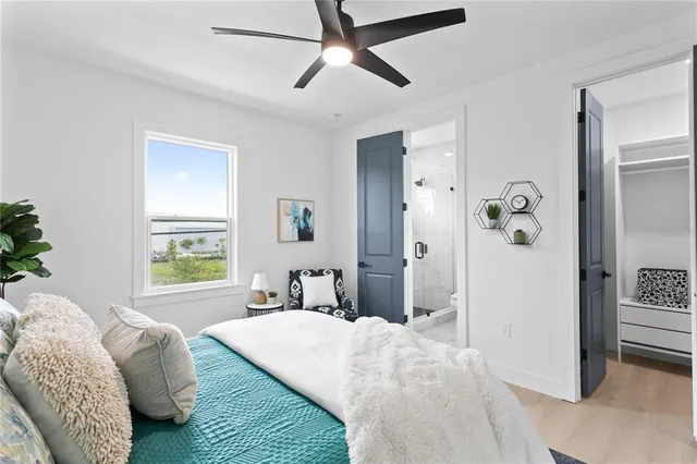 an aerial view of residential houses with outdoor space and swimming pool