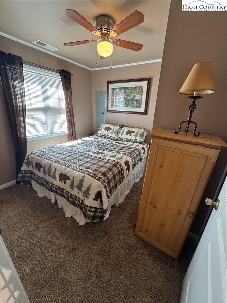 84 Avery High School Road Newland, NC 28657 - Photo 12 of 29 a bedroom with a bed dresser and window