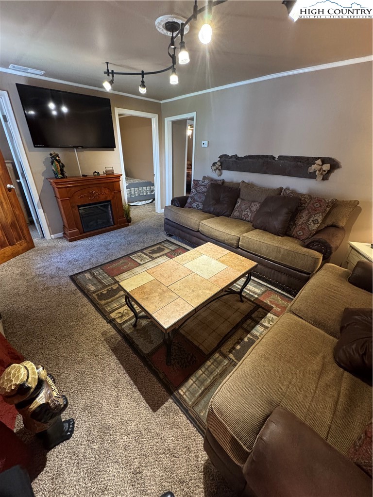 84 Avery High School Road Newland, NC 28657 - Photo 15 of 29 a living room with furniture and a flat screen tv