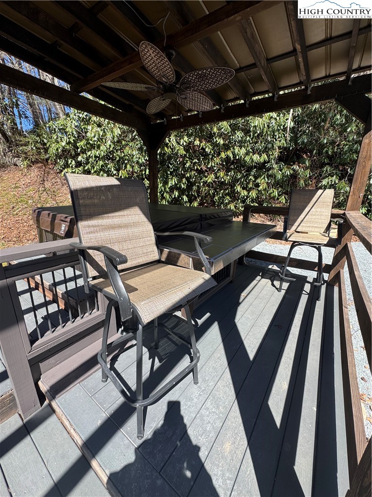 84 Avery High School Road Newland, NC 28657 - Photo 21 of 29 a view of a chairs and table in patio with a barbeque
