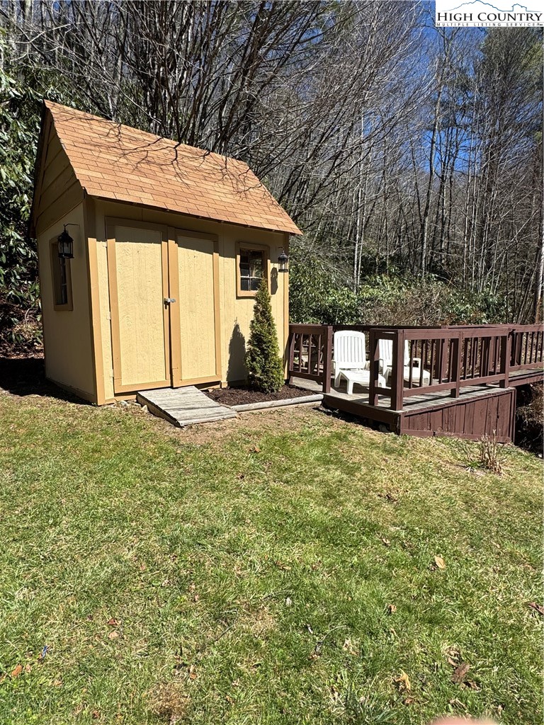 84 Avery High School Road Newland, NC 28657 - Photo 27 of 29 a view of a house with backyard porch and wooden floor