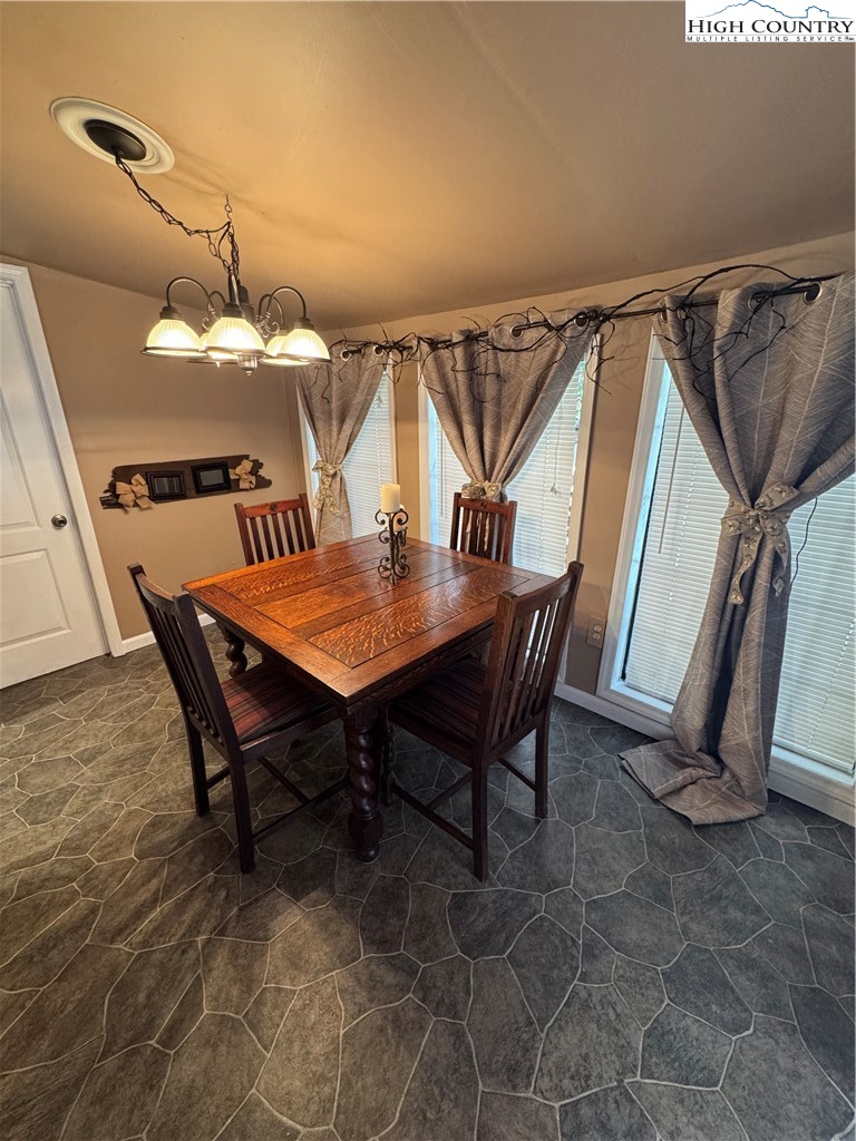 84 Avery High School Road Newland, NC 28657 - Photo 4 of 29 a dining room with furniture and window