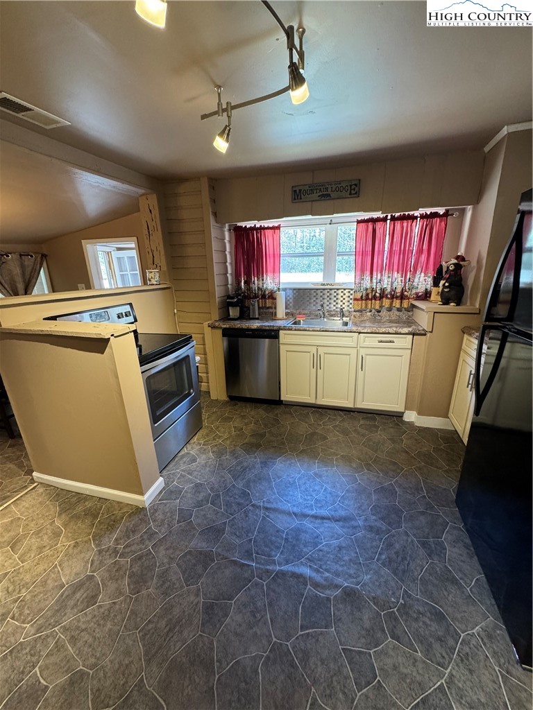 84 Avery High School Road Newland, NC 28657 - Photo 5 of 29 a kitchen with stainless steel appliances granite countertop a stove a sink dishwasher and a refrigerator