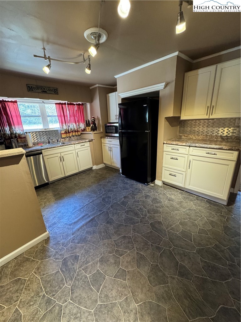 84 Avery High School Road Newland, NC 28657 - Photo 7 of 29 a kitchen with stainless steel appliances granite countertop a refrigerator and a stove top oven