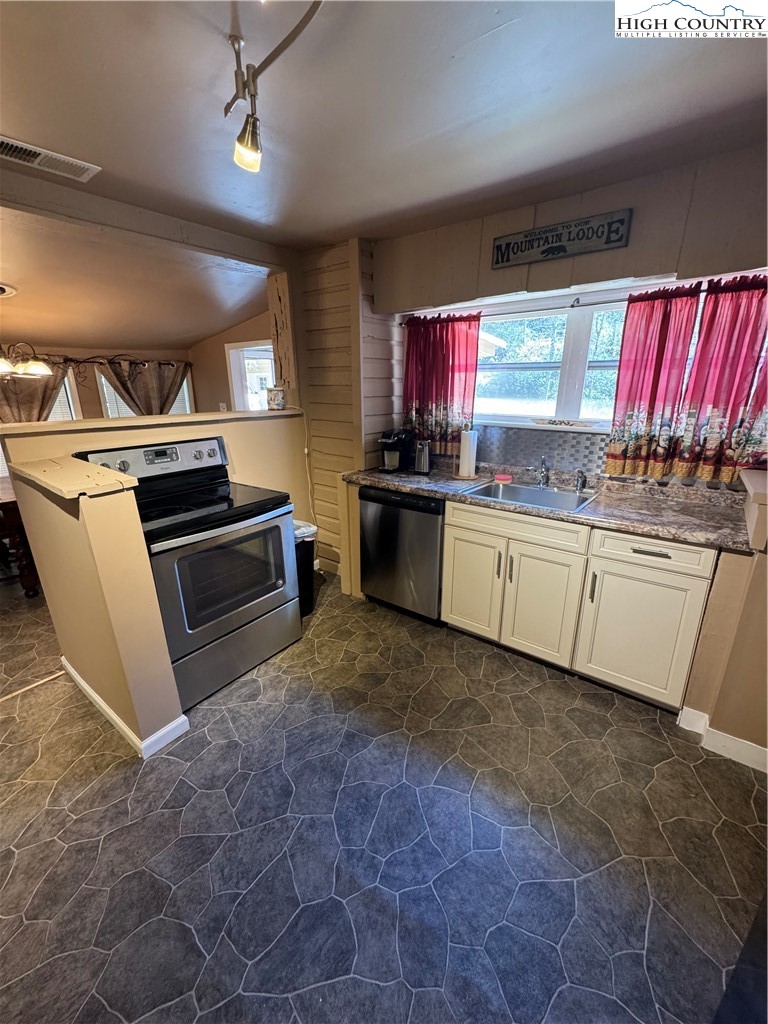 84 Avery High School Road Newland, NC 28657 - Photo 8 of 29 a kitchen with stainless steel appliances a stove sink and microwave