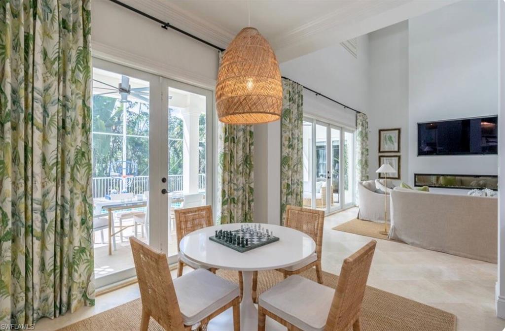 428 Rudder Road Naples, FL 34102 - Photo 17 of 49 a view of a dining room with furniture window and outside view