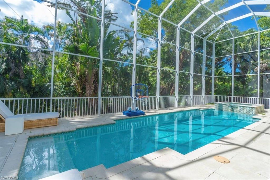 428 Rudder Road Naples, FL 34102 - Photo 18 of 49 a view of a chair and table