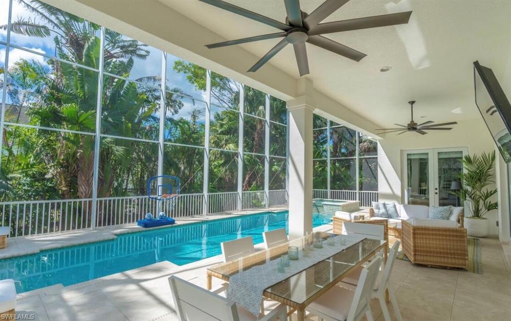 428 Rudder Road Naples, FL 34102 - Photo 20 of 49 a view of a porch with furniture and a yard
