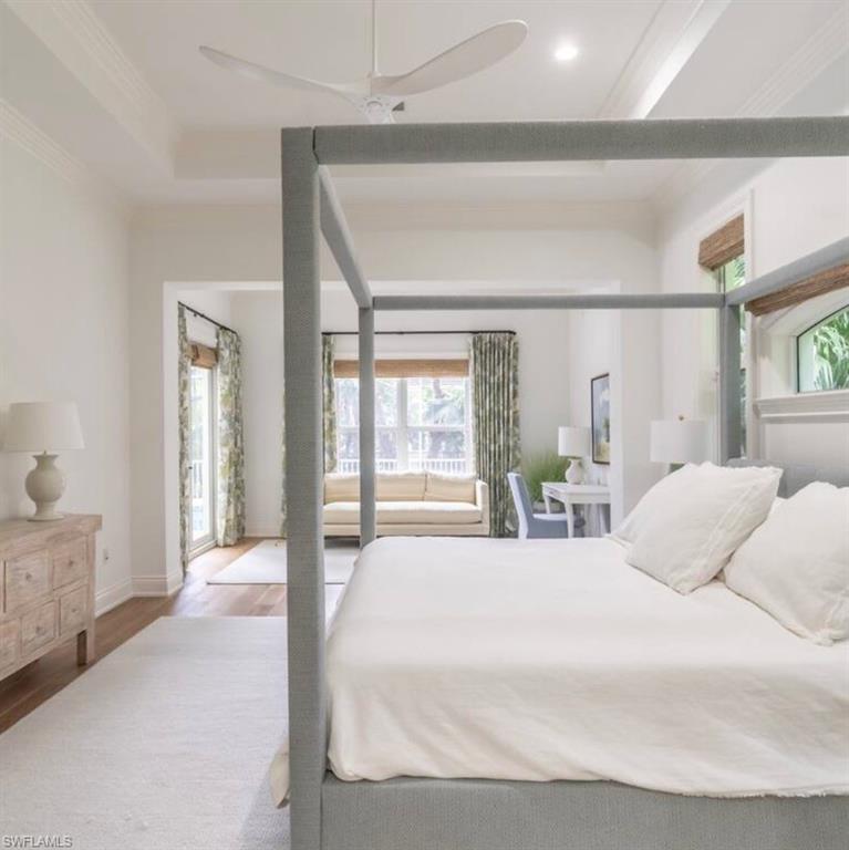 428 Rudder Road Naples, FL 34102 - Photo 23 of 49 a bedroom with a large bed and a large window