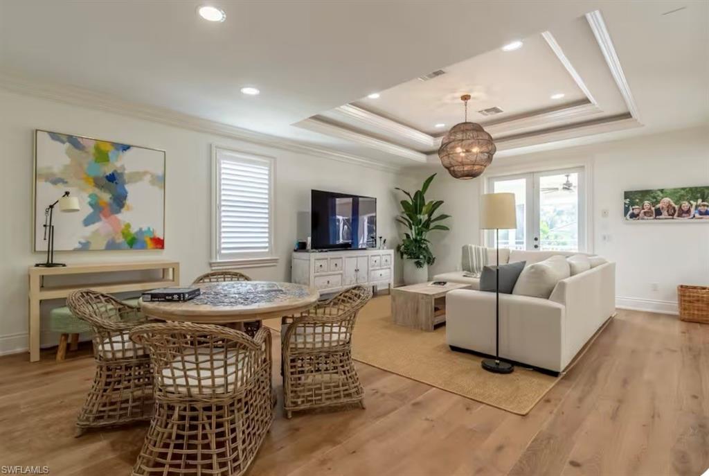 428 Rudder Road Naples, FL 34102 - Photo 31 of 49 a living room with furniture and a large window