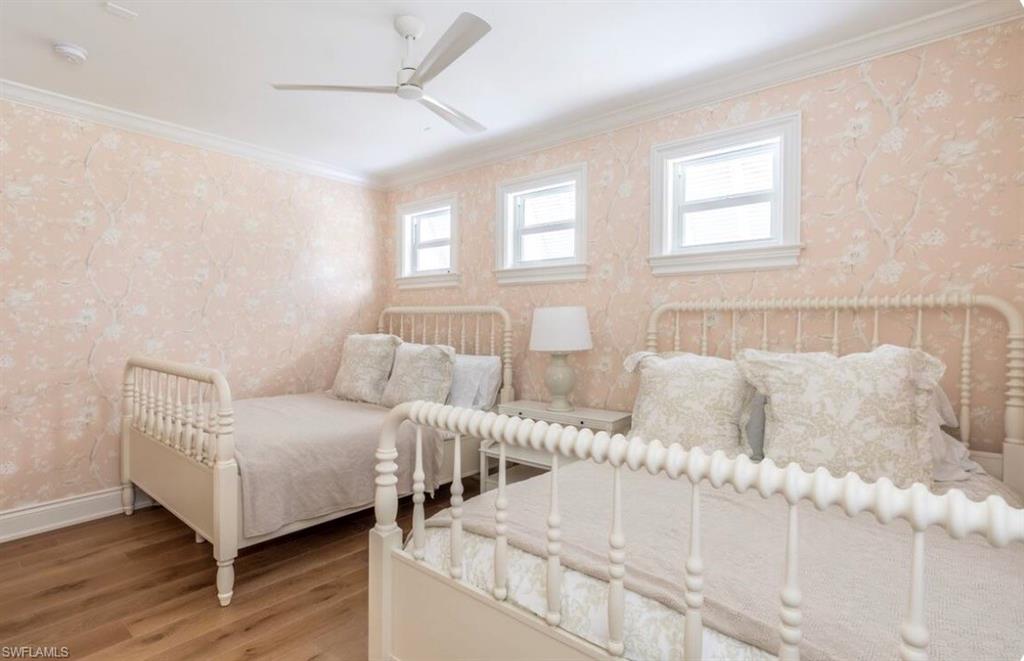 428 Rudder Road Naples, FL 34102 - Photo 35 of 49 a living room with furniture and wooden floor