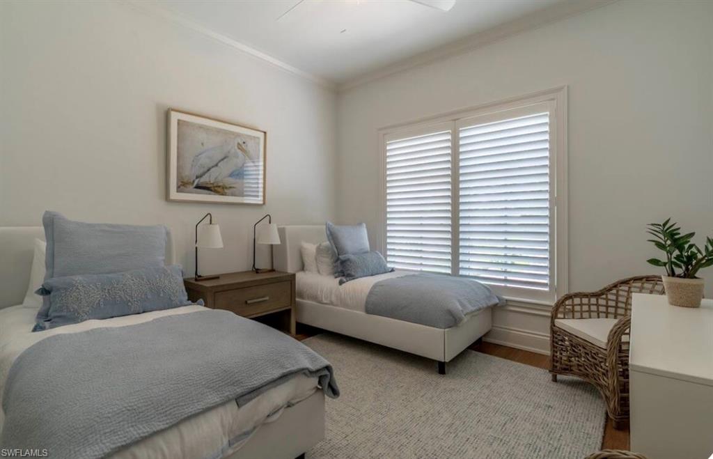 428 Rudder Road Naples, FL 34102 - Photo 39 of 49 a bedroom with bed and window