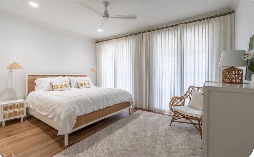 428 Rudder Road Naples, FL 34102 - Photo 40 of 49 a bedroom with a bed and a window